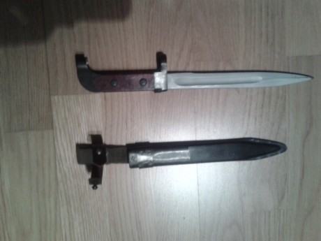 Hola. Alguien podria darme informacion sobre esta bayoneta? A que arma pertenece y pais. No lleva ningun 02