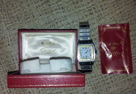 Reloj Cartier Santos tamaño Cadete automatico, en perfecto funcionamiento, con señales de uso. Con su 00
