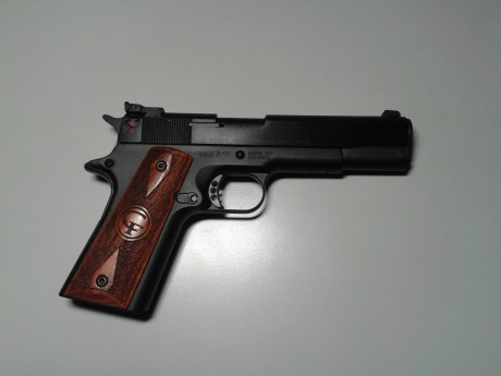 Hola quería saber si alguien tiene una pistola como esta, y si me puede decir como suavizar el gatillo 00
