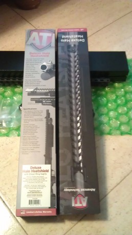 Vendo este heatshield de ATi modelo deluxe v block ghost ring sight. Con dos pequeños carriles  21mm weaber.para 12