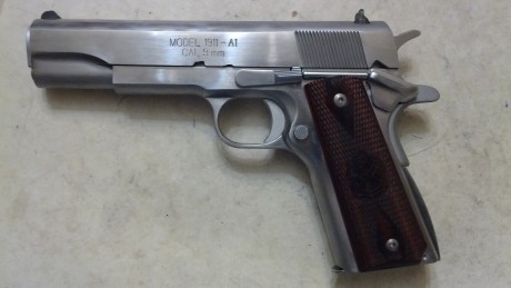 Lo dicho: vendo o cambio esta magnífica pistola de 9mm para. guiada en F, con cachas de cocobolo y disparador 10
