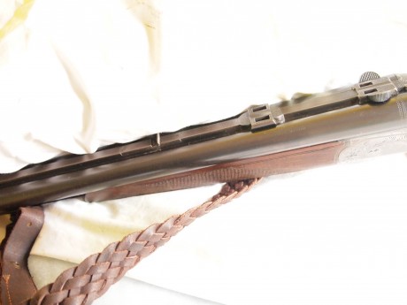 drilling Merkel , con cañones de escopeta calibre  12/70 12/70 y cañon de rifle  7x57r , lleva un visor 01