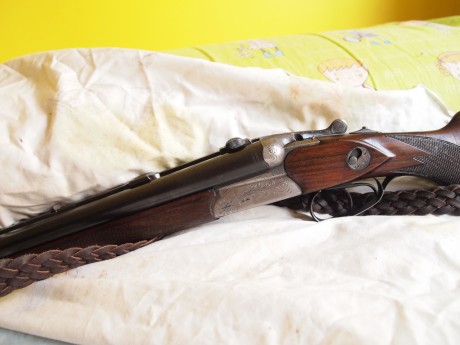 drilling Merkel , con cañones de escopeta calibre  12/70 12/70 y cañon de rifle  7x57r , lleva un visor 00
