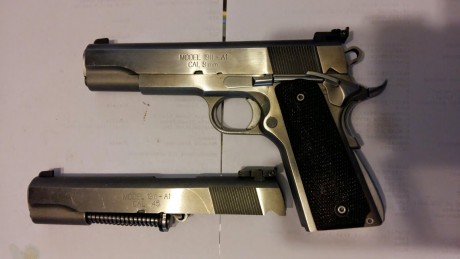 Vendo mi Pistola SPRINGFIELD ARMONI 1911 con sus cuatro calibres los carros de 9mm para y 45 ACP son orijinales 00