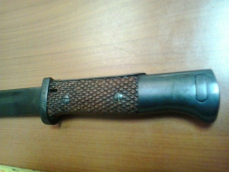 He comprado esta bayoneta mod 1941 pero no se si es original las cachas y el fosfatado, puede ser algún 00
