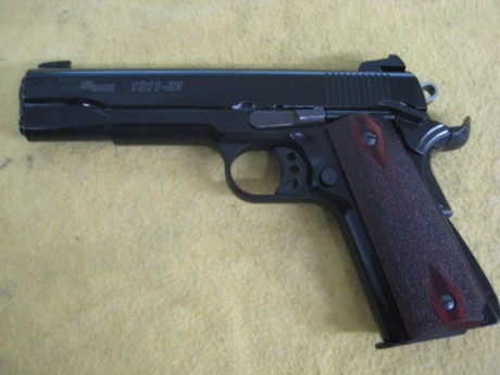 Hola un amigo vende Sig-Sauer 1911-22, (calibre 22), está como nueva, precio 250 euros, más 20 de portes 02
