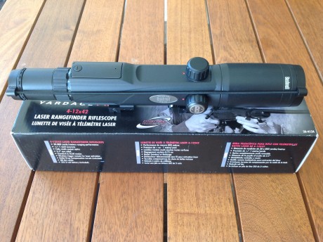 Visor Bushnell modelo pro 4x12x42 con Telemetro láser incorporado. Retícula mildot.
Incluye tapas protectoras, 02