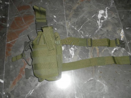 vendo esta funda de pistola pernera  , es sin estrenar tiene hueco para un cargador extra , es regulable 01