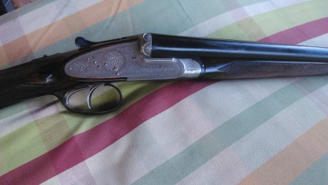 Escopeta Danokbat fina cal. 12, paralela, expulsora, pletina entera, con grabados finos y en perfecto 00
