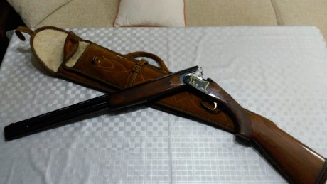 Buenas noches,me venden una superpuesta lanber el dueño dice que es la hunter tiene la bascula negra con 02