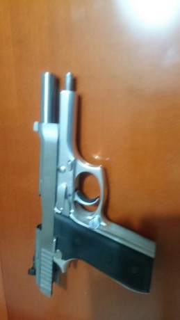 Vendo Pistola Taurus PT99 AFS inox, 9 mm Pb, con maletin de combinacion, dos cargadores, instrucciones. 01