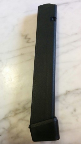 Vendo un cargador marca Promag con capacidad de 32 cartuchos 9mmP NUEVO( SIN ESTRENAR) para pistolas Glock 00