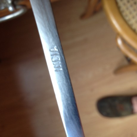 hola me he comprado este sable  cosaco quisiera saber si es una replica o es autentico 02