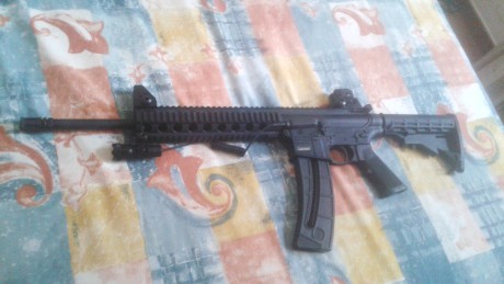 hola vendo este lote de escopeta del 12 marca laurona 92 +carabina  S&W mp15 Calibre 22 LR  Nueva 00