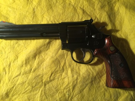 Vendo revolver smith & wetson , calibre 357, 6 pulgadas color negro, seminuevo, se ha disparado muy 01