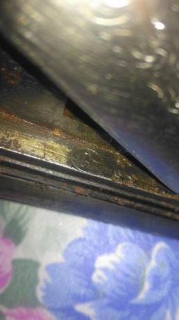 hola tengo una escopeta antigua de caza monotiro tiene el símbolo E.LG  sin corona quisiera saver algo 40