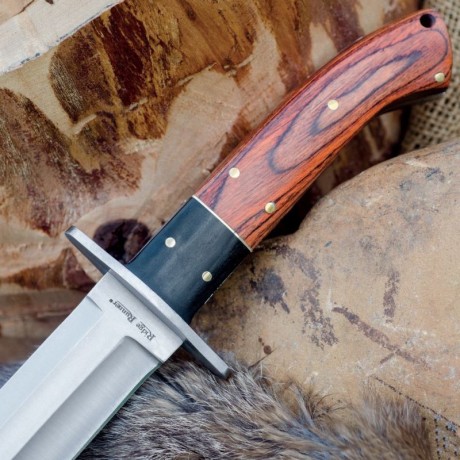 Se vende precioso cuchillo Bowie, nuevo. Caza supervivencia.
Hoja de una pieza,mango dxxe madera con adornos 01