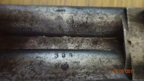 Podrían ayudarme con la identificación de esta escopeta,  no se alcanza a ver ningún marcaje del fabricante; 11
