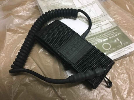 Vendido Pistol Lanyard, nuevo a estrenar. Sujeta arma corta al cinturón para que no caiga durante movimientos 00