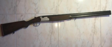 Escopeta de caza Beretta modelo S56E. Tiene chokes de 1 y 3 estrellas así como doble disparador, no selectivo. 02