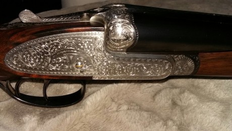 Un amigo me pasa esta escopeta que pone en venta. 
Cañon 69; 6 y 10 décimas. Recámaras 18.5
Cañones cromo-niquel. 01