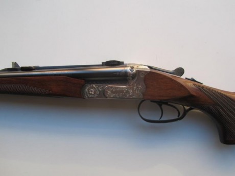 Vendo rifle express Merkel, modelo 141 E, 9,3 x 74R, pletinas con grabados de escenas de caza, y monturas 01