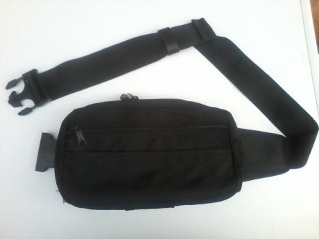 vendo funda rinonera para pistola y un cargador interior, dos departamentos extrior para otro cargador 00
