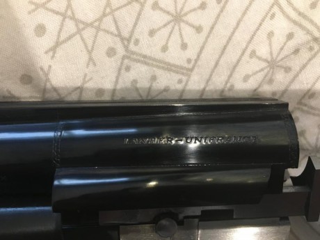 Escopeta de tiro al plato marca Lamber modelo Superlamber 2099. Ecopeta es expulsora, tiene selector de 20