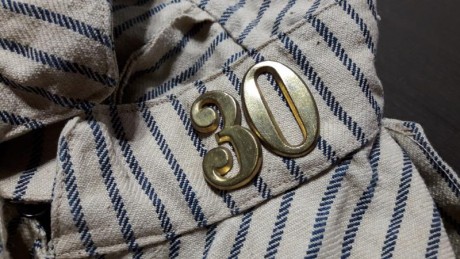 Buenas noches en una limpieza en casa de unos familiares, entre ropa antigua he localizado un unifrome 00