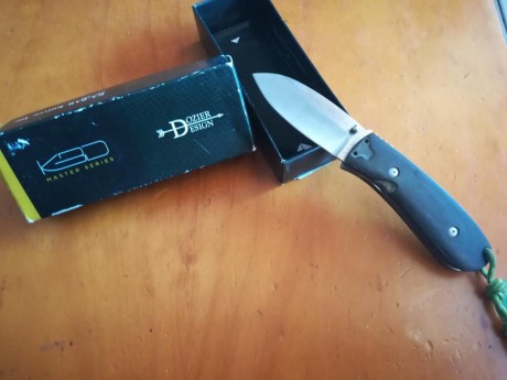 Navaja en perfecto estado por lo que he leído ya no se fabrican acero aus-8 ,micarta verde 8 cm de hoja 01
