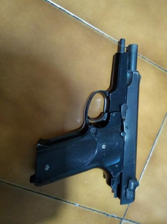 Cambio S&W mod 59,. 9 mm, por revolver de 3" en F.
Viene con caja original, instrucciones, baqueta, 10