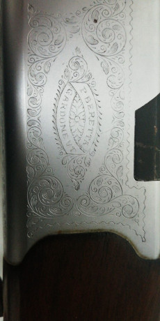 Un compañero tiene una superpuesta beretta expulsora, con selector, tendra unos 40 años y lleva grabado: 02
