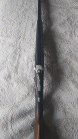un amigo vende una escopeta superpuesta aya 34 expulsora calibre 12 con 76cms cañones tres y una estrellas 11
