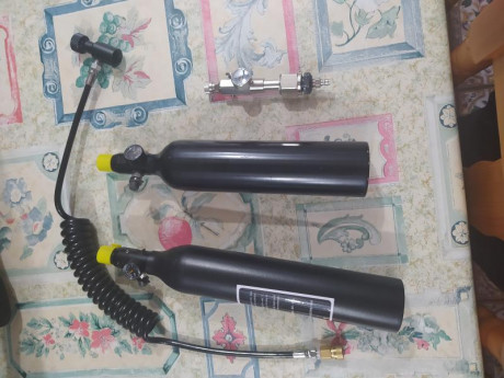 Buenas tardes se venden 2 botellas para cargar carabinas pcp de 1/2 litro cada una con su estación de 00