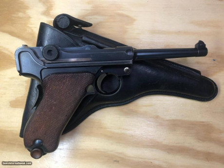 Por favor, busco  Luger DWM 1906 Portuguesa, 7,65 mm, cañón militar de 4/34 ", empuñadura de seguridad, 00