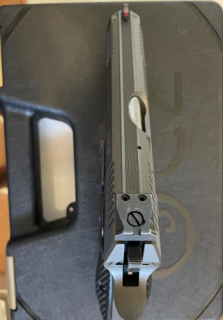 Arma con un año y medio de antiguedad ,recién pintada en cerakote gris tugsteno,martillo competición.Se 00