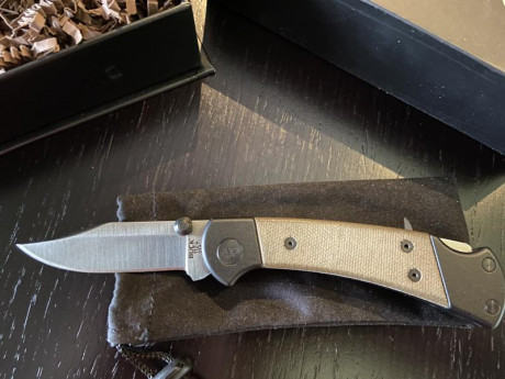 Vuelve a la venta  està Buck  Ranger Sport con cachas en micarta canvas y acero S30V. Sin ningún uso y 01