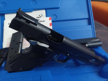 Pongo a la venta mi pistola 1911 Springfield calibre del 9 y carro del 45 acp marca llama en buen estado 01