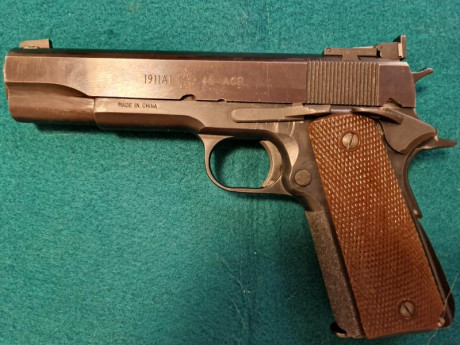 Norinco A 1 del 45 ACP , mejorada.

Alza Wilson Combat y punto de mira, super ajustada.

Muy precisa.

El 00
