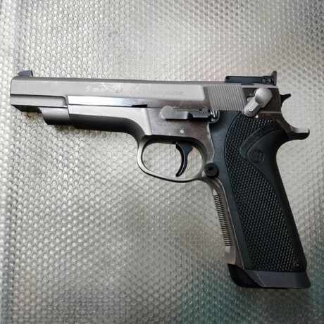 Busco pistola de 9mm S&W target champion o PPC. 21