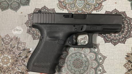 Vendo Glock 19 con disparador aligerado retén de corredera y botones de cargador sobredimensionado llevaría 00