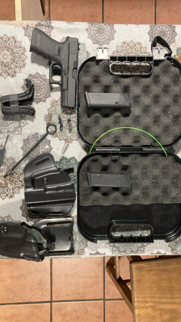 Vendo Glock 19 con disparador aligerado retén de corredera y botones de cargador sobredimensionado llevaría 02