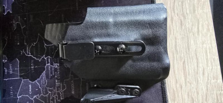 Funda IWB de la marca AMG para portar una H&k p2000sk con linterna olight valkyrie pl mini 2 
precio 02