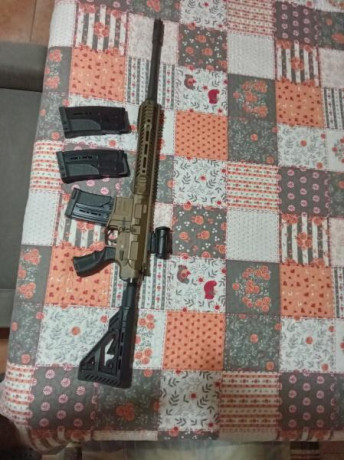 Buenas vendo escopeta UTAS XTR12 en color bronce con 3 cargadores con capacidad de 5 cartuchos 2 y uno 11