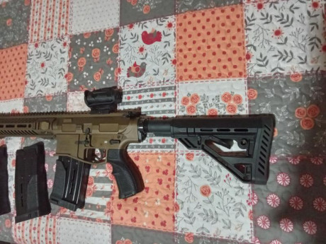 Buenas vendo escopeta UTAS XTR12 en color bronce con 3 cargadores con capacidad de 5 cartuchos 2 y uno 10