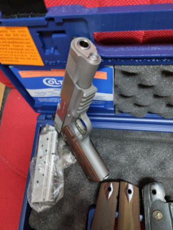 Vendo pistola Colt Governament 1911, 9mm y acero inoxidable. Seguro de empuñadura, alza regulable y dos 02