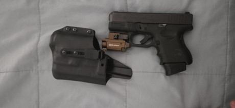Se vende Glock 26 con menos de 1000 disparos, con mira de tritio, linterna olight con puntero laser recargable. 02